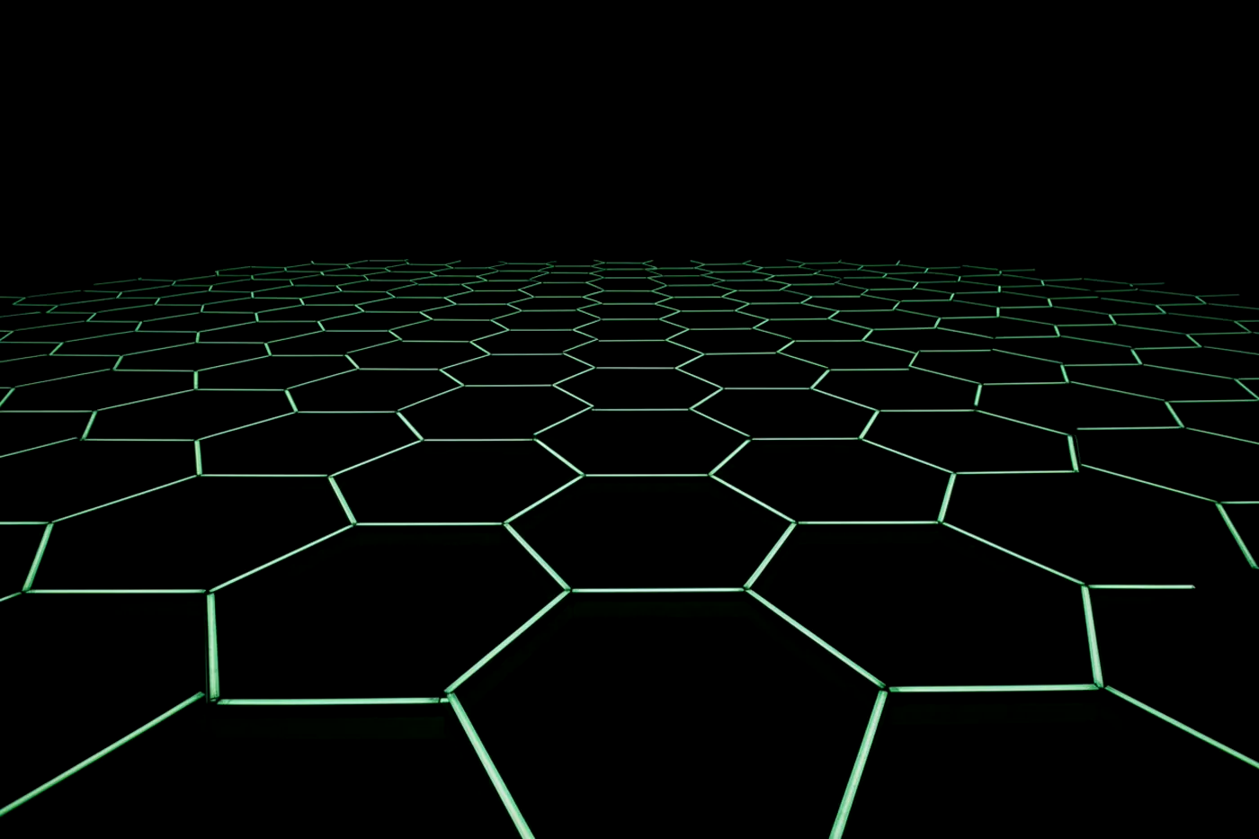 A building facade at night built from a repeating hexagonal lattice